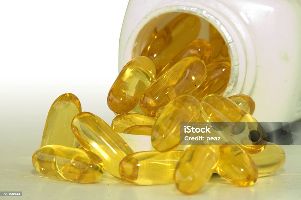 Fish Oil Pills A bottle of omega 3 fish oil capsules Bottle Stock Photo