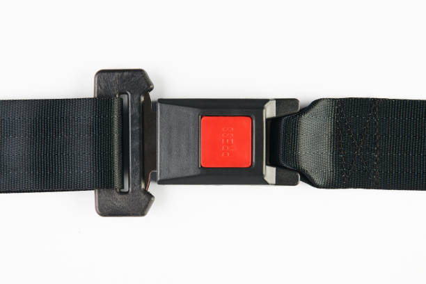 istock Fastened seat belt isolated on white background, close-up. Safet 941584904