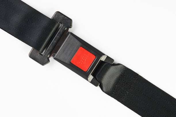 istock Fastened seat belt isolated on white background, close-up. Safet 941584936