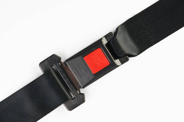 istock Fastened seat belt isolated on white background, close-up. Safet 941584980