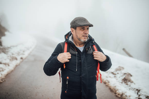 istock Senior man hiking on mountain 941585378
