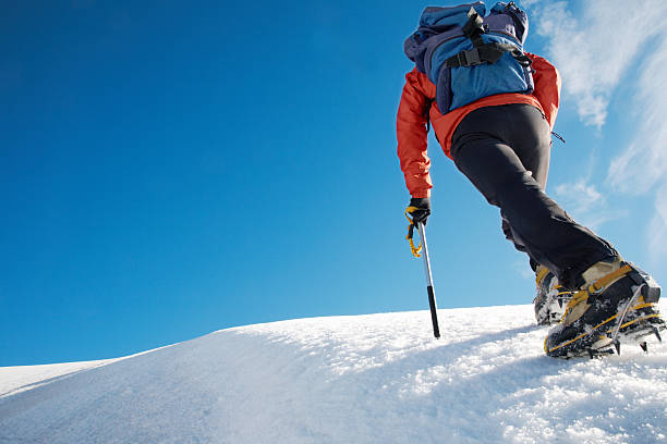istock A mountain climber trekking an icy path  94158870