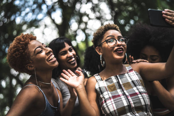 istock Cheerful friends taking selfie 941592626