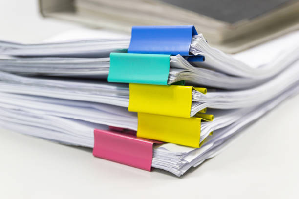 istock Stack of papers documents in archives files with paper clips on desk at offices, business concept. 941592790