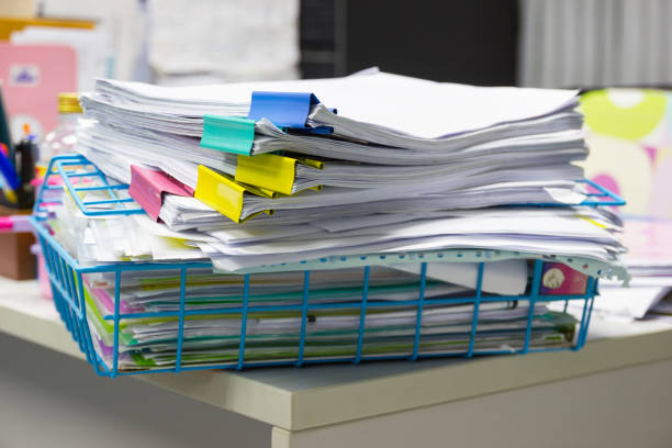istock Stack of papers documents in archives files with paper clips on desk at offices, business concept. 941592804