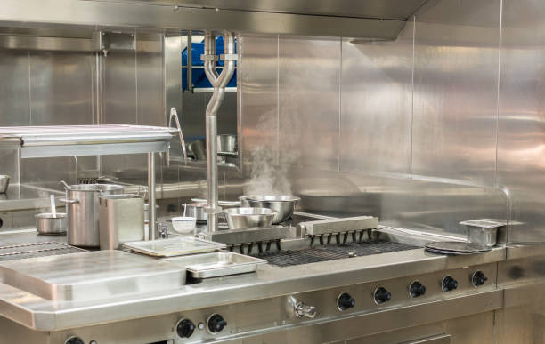 istock Modern stainless steel hobs in commercial kitchen 941593138