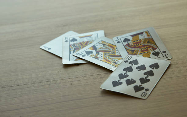 istock hand of royal flush 941596786