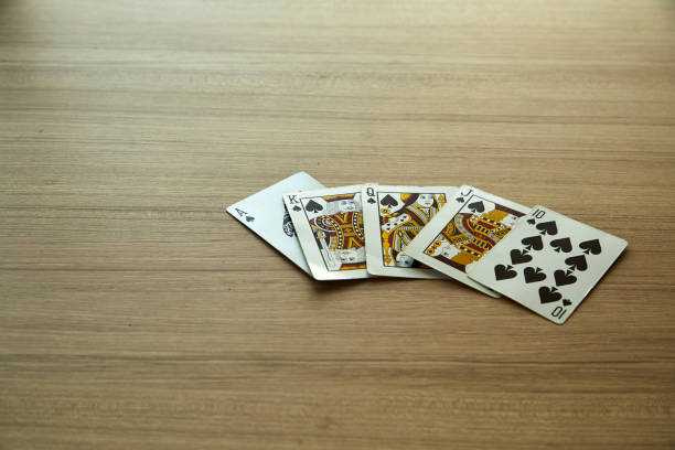 istock hand of royal flush 941596832