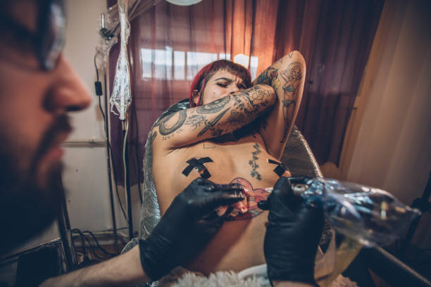 istock Painful new tattoo 941612450