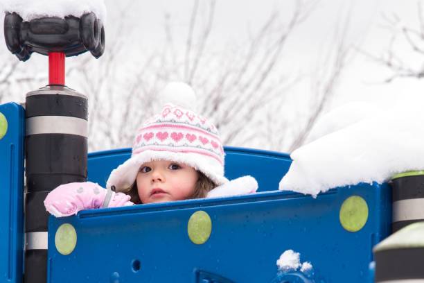 Toddler playing in a snow day