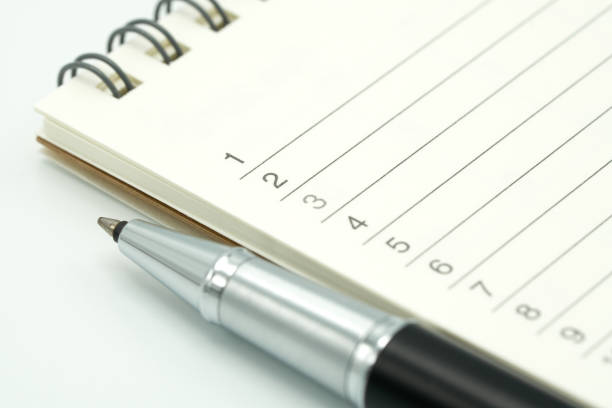 istock A pen is placed on a Book Rankings(list). using as background business concept and Planning concept with copy spaces for your text or design. 941621816