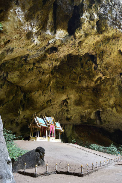 istock Pavillon with huge stone wall in cave 941623984