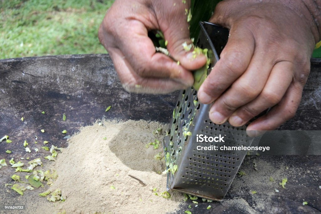 Cook Islander man prepares Kava drink in Rarotonga Cook Island Cook Islander man prepares Kava drink on an Eco tourism tour in Rarotonga Cook Islands. Kava is a mildly narcotic drink made from mixing the powdered root of the pepper plant with water.Cook Islander man prepares Kava drink on an Eco tourism tour in Rarotonga Cook Islands. Kava is a mildly narcotic drink made from mixing the powdered root of the pepper plant with water. Kava Kava Stock Photo