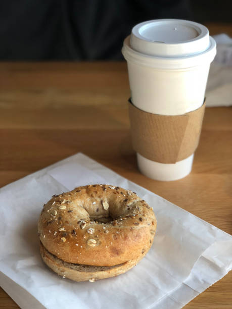 istock Whole Grain Breakfast Bagel with Coffee Cup 941627466