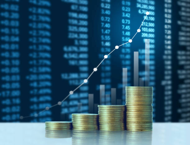 istock Coins graph stock market 941639906