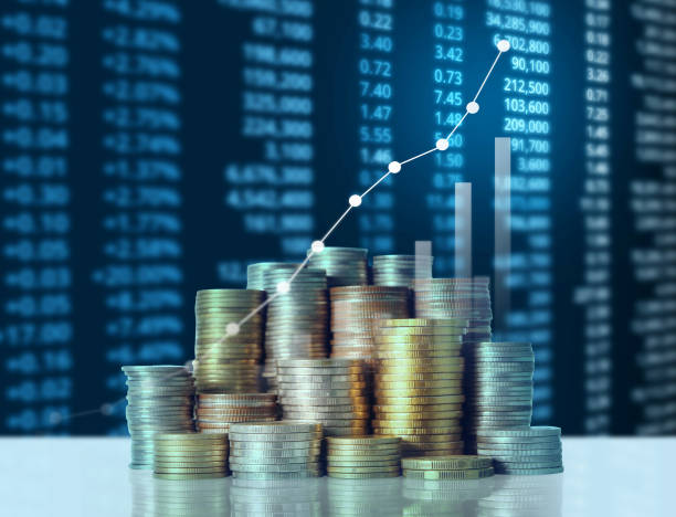 istock Coins graph stock market 941639922