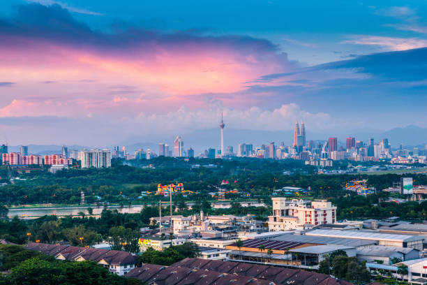 istock Kuala Lumpur City Skyline with Sunset Clouds 941641984