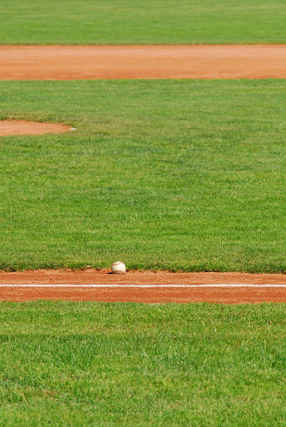 istock Baseball - A ball in the fist base line 94164932