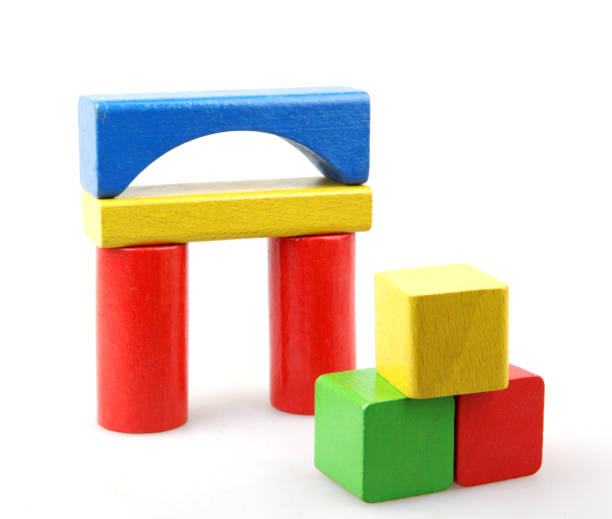istock Wooden building blocks isolated on white background 941659376