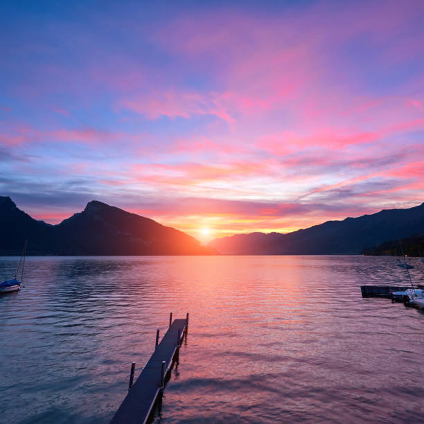 Lake Geneva in dramatic sky at sunset, Switzerland.