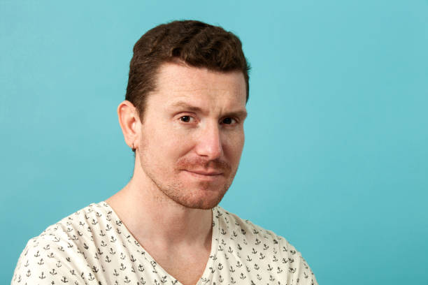 istock close-up portrait of a young man in studio 941665326