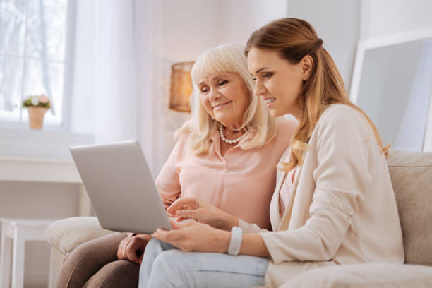 istock Nice elderly woman looking at the laptop screen 941665490