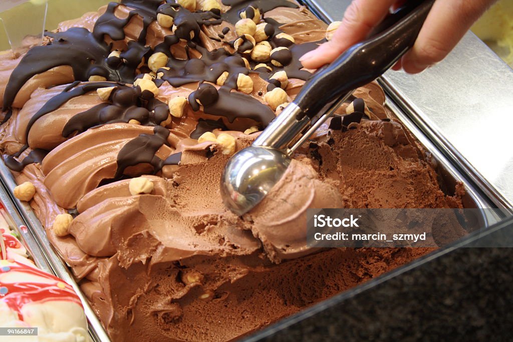 Chocolate ice cream with scooper Serve Ice Cream at ice cream parlor Ice Cream Parlor Stock Photo