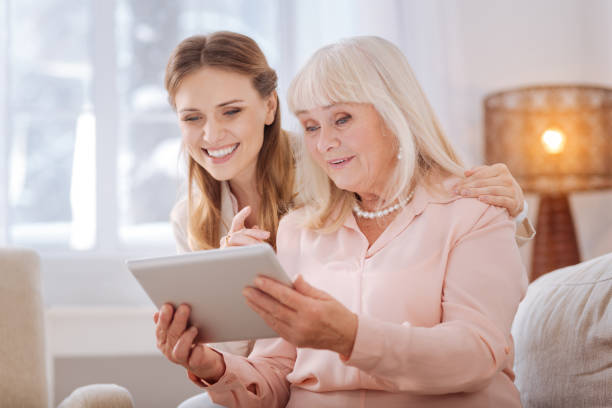 istock Positive senior woman using new technology 941668960