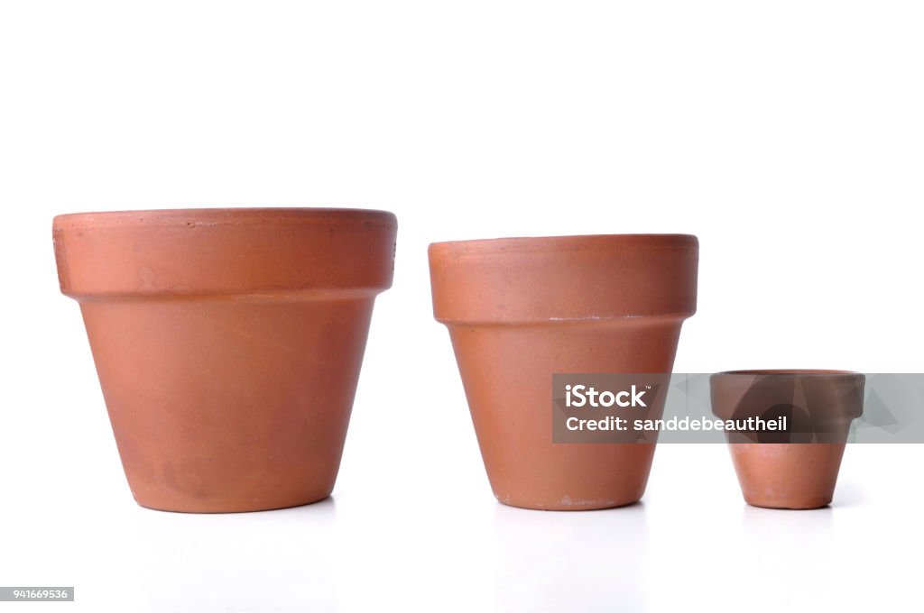 little and big  terra cotta pots little and big  terra cotta pots isolated on white background Flower Pot Stock Photo