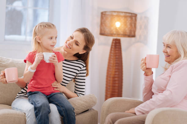 istock Joyful pleasant family having tea 941673048