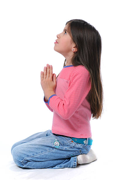 istock Girl On Her Knees Praying 94167337