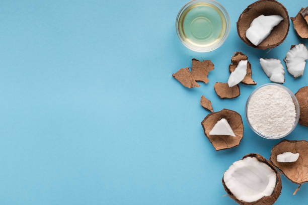 istock Plate with coconut flour and water on blue background 941677706