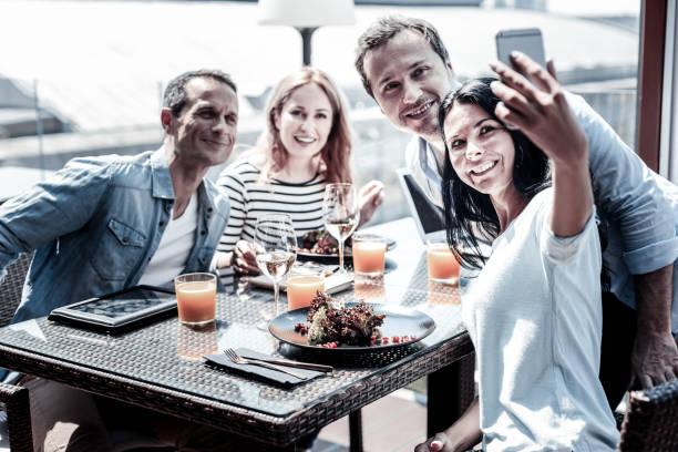 istock Positive young woman taking selfie 941677832