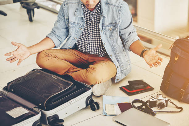 An Asian male traveler is experiencing the problem of need and lost value at the airport. stock photo