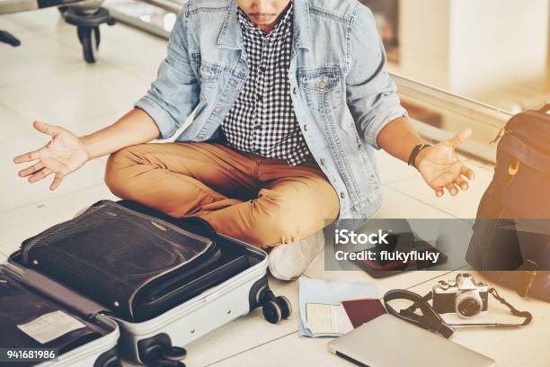 An Asian Male Traveler Is Experiencing The Problem Of Need And Lost Value At The Airport Stock Photo - Download Image Now