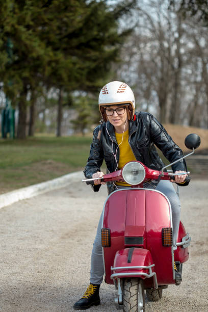 istock girl in the scooter 941682030