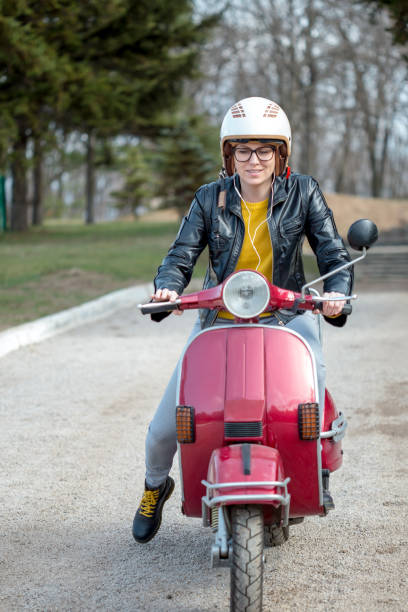 istock girl in the scooter 941682216