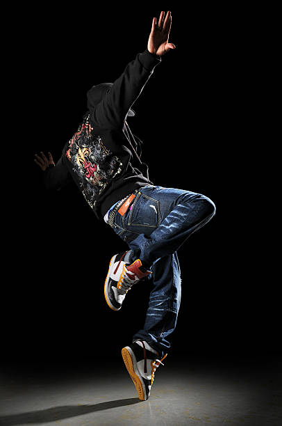 A single hip hop dancer pictured on a black background stock photo