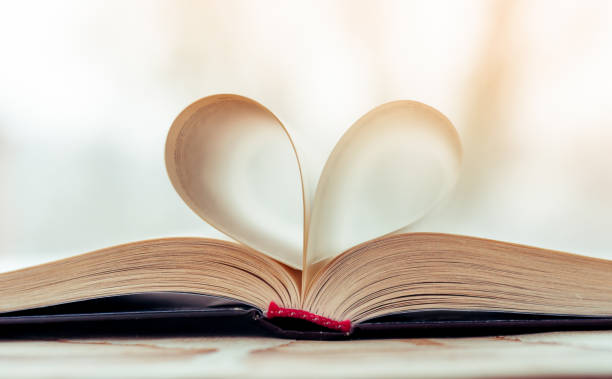 istock vintage style, heart shape from paper book, close up 941682720