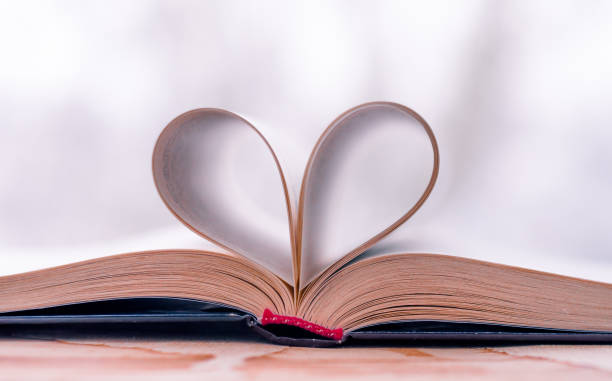 istock vintage style, heart shape from paper book, close up 941682756