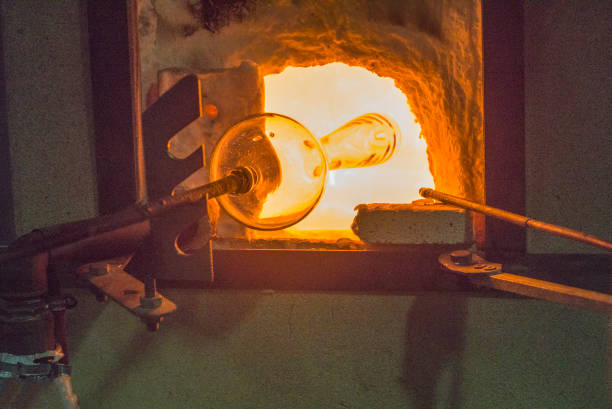 Traditional glassblowing worker shaped  liquid glass