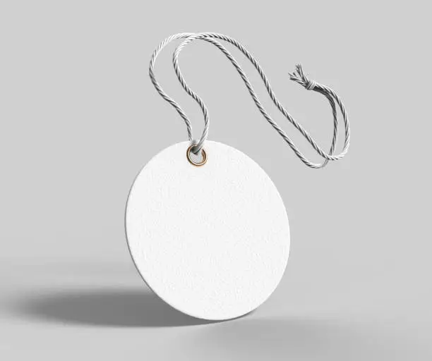 Photo of Blank tag tied with string. Price tag, gift tag, sale tag, address label isolated on grey background. 3d render illustration.