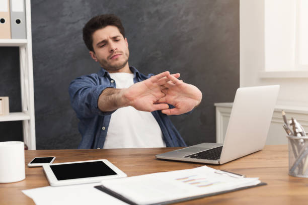 istock Young relaxed businessman with laptop in office 941684168