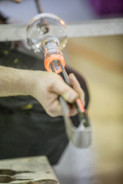 istock Glass blowing in factory 941686568