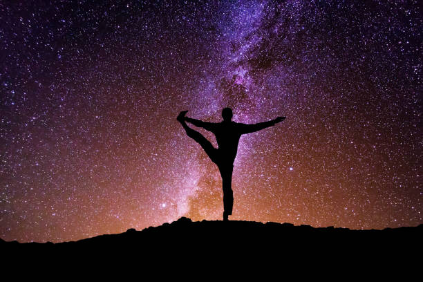 istock The man with yoga posture on the mountain at night. 941687202
