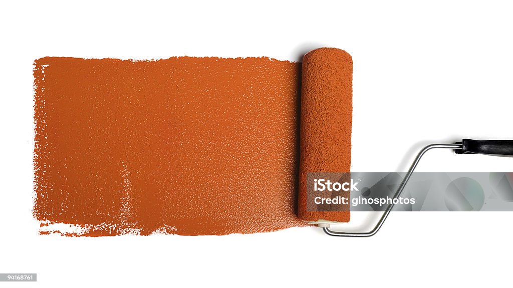 Роликовый с оранжевой краской - Стоковые фото Малярный валик роялти-фри