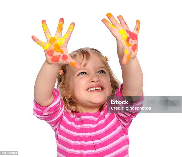 Chica Con Pintura En Las Manos Foto de stock y más banco de imágenes de Alegre - Alegre, Alegría, Amarillo - Color