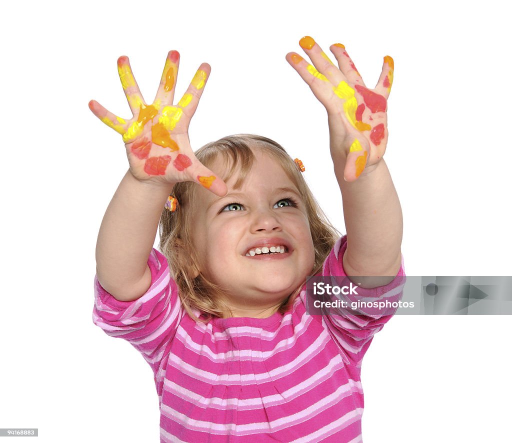 Jeune fille avec peinture sur les mains - Photo de Blanc libre de droits