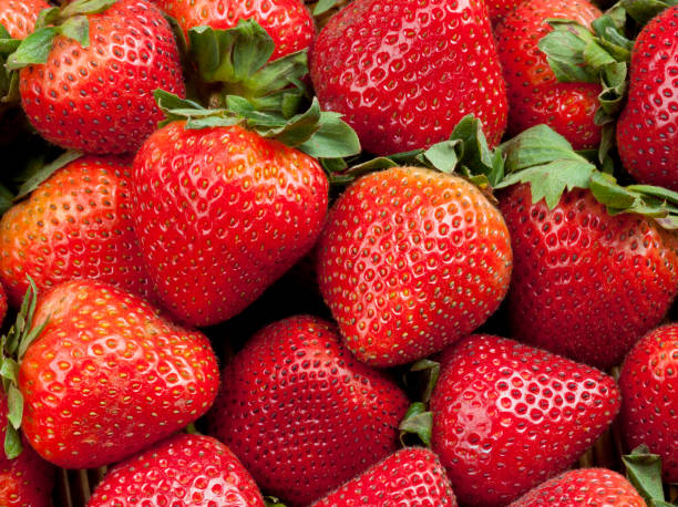 istock Fresh Strawberries with Green Leaves 941690774
