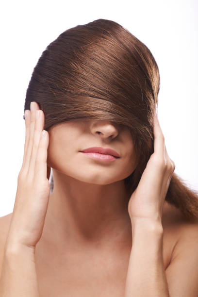 istock Young Woman with Glossy Hair 941702358